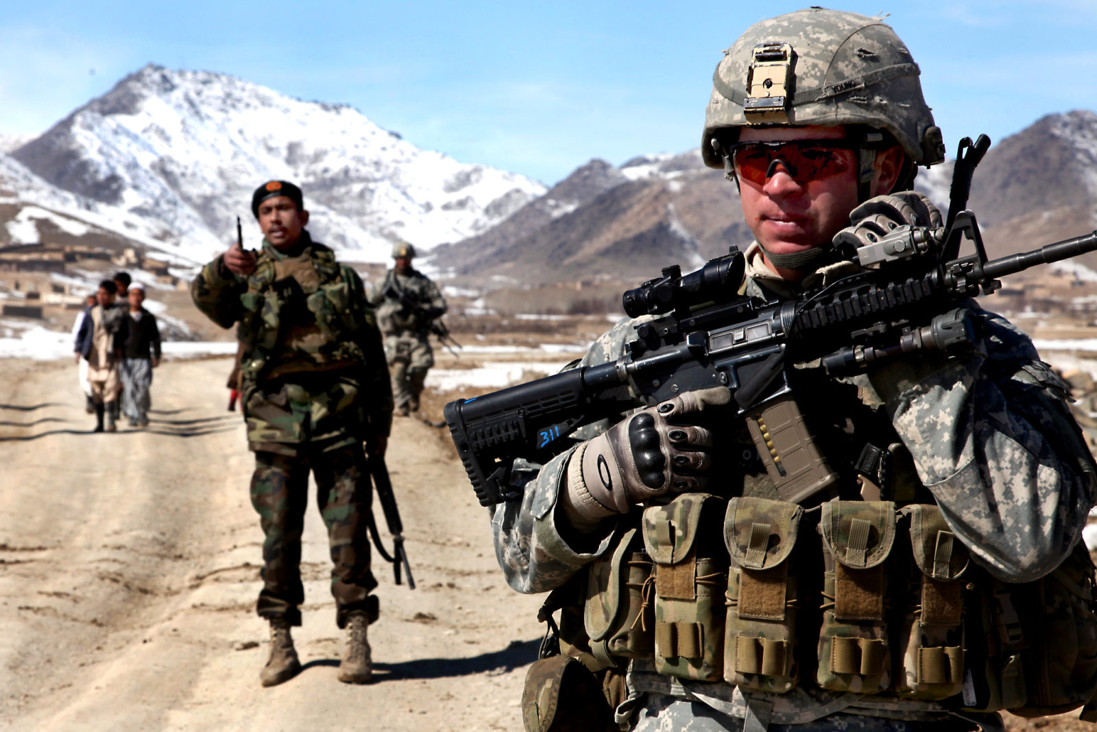 A trooper with the 173rd Airborne Brigade on patrol with Afghan soldiers in Wardak province, Feb. 2010.